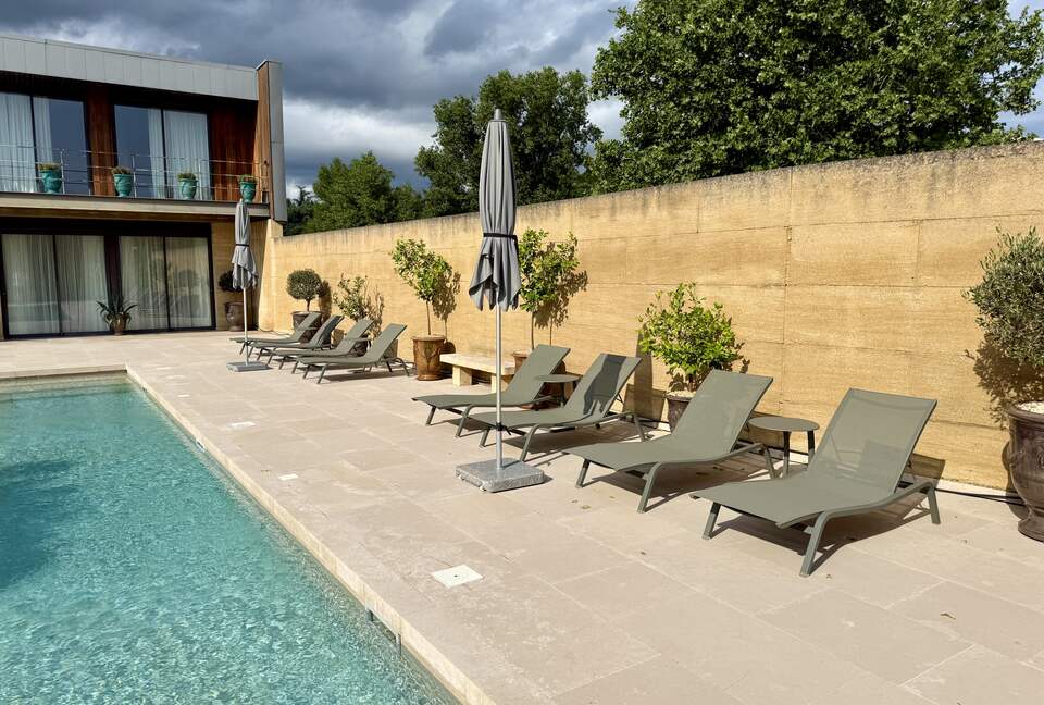 Pool: Fermob loungers & wind resistent umbrellas; view Main