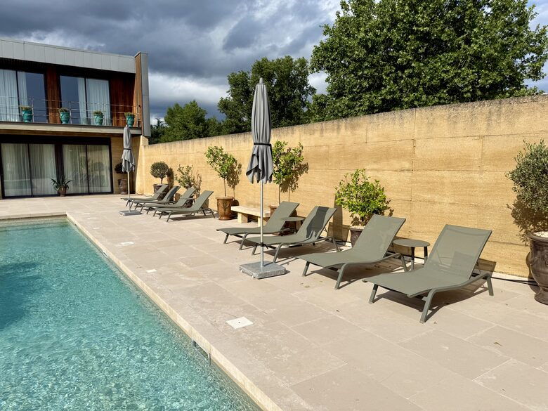 Pool: Fermob loungers & wind resistent umbrellas; view Main