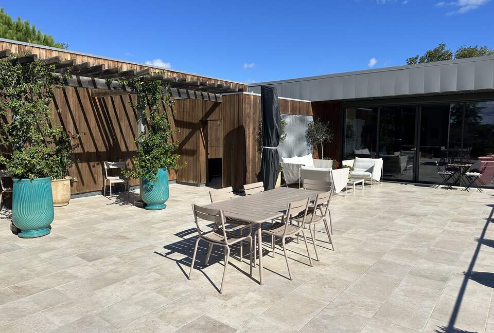 Main Upper: Terrace dining, view towards open living area