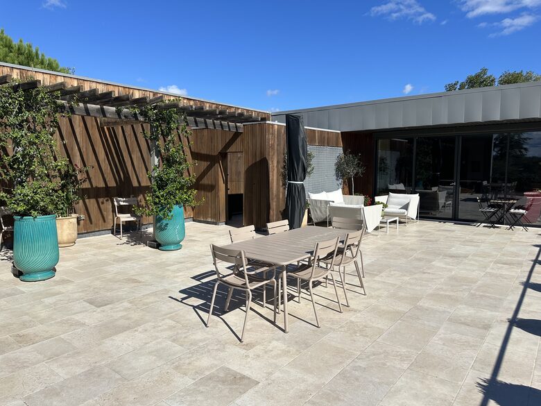 Main Upper: Terrace dining, view towards open living area