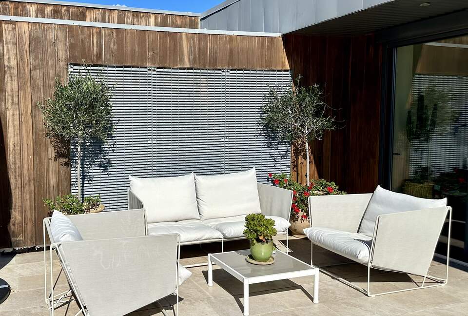 Main Upper: Terrace seating outside open living area