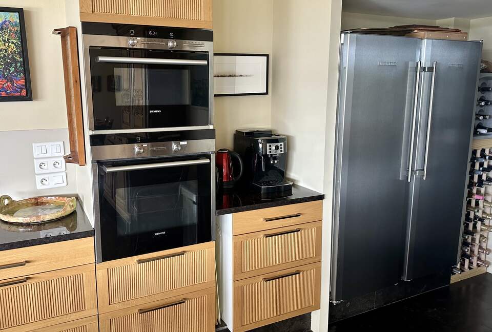 Main Upper: Kitchen oven, microwave, double fridge, coffee