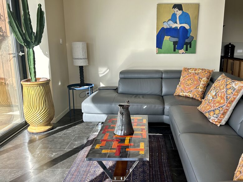 Main Upper: Open living with leather sofa