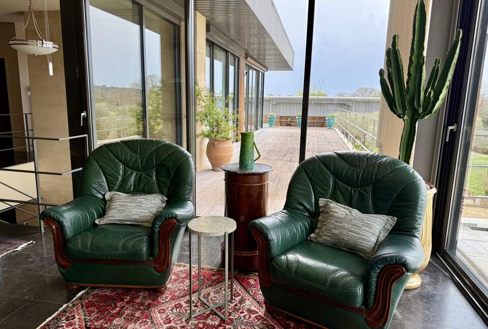Main Upper: Open living with view towards terrace and Guest