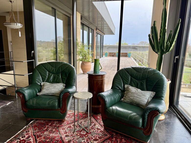 Main Upper: Open living with view towards terrace and Guest