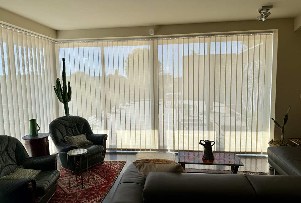 Main Upper: Open living with view towards terrace