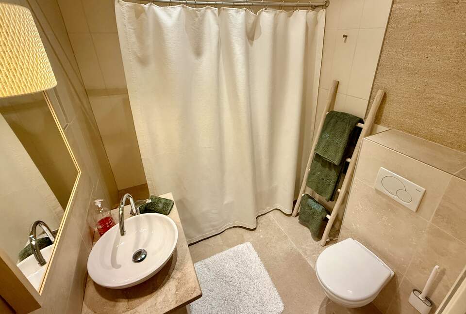 Main: En suite bathroom for bedroom 2 (tub and shower)