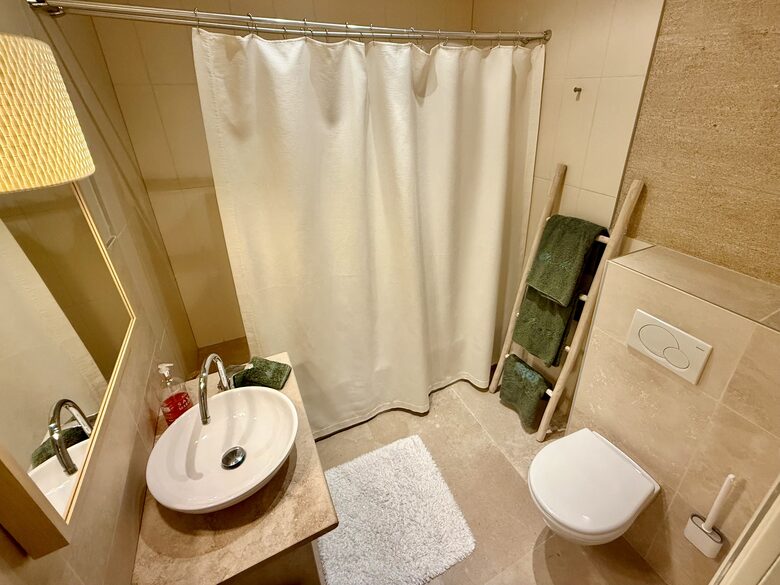Main: En suite bathroom for bedroom 2 (tub and shower)