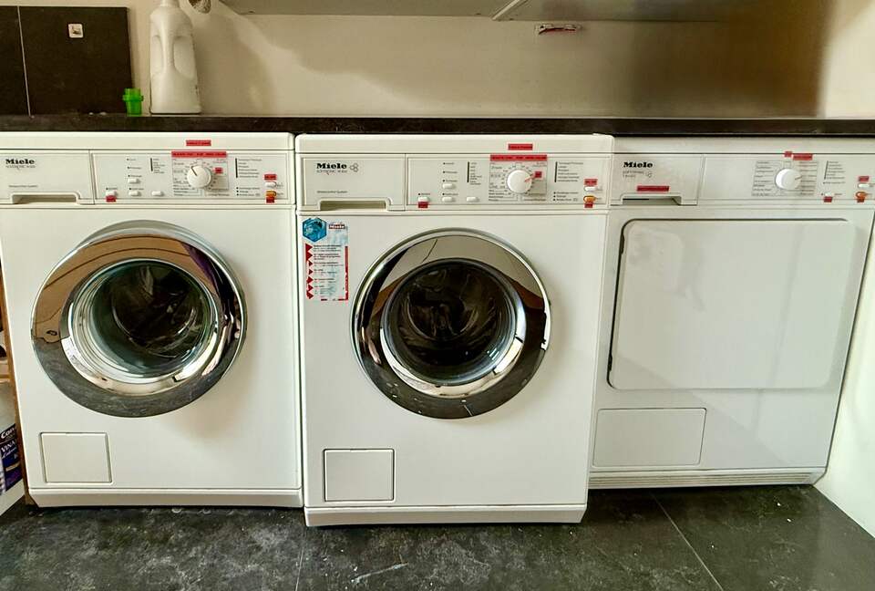 Main Upper: Laundry room; two Miele washers and evap dryer