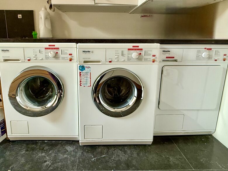 Main Upper: Laundry room; two Miele washers and evap dryer