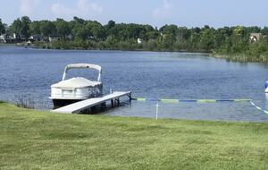 Sandy bottom swim area and boat dock