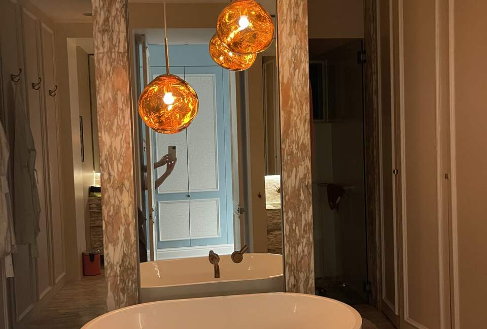 Main bathroom with bath, shower, toilet and twin basins