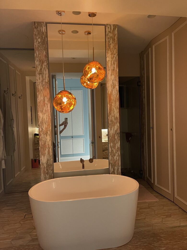 Main bathroom with bath, shower, toilet and twin basins