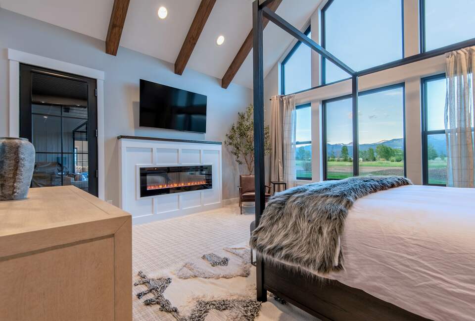 The "Grand" master suite, sitting area w/ 65" TV & fireplace