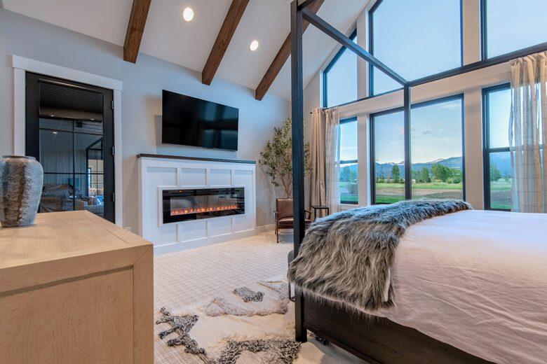 The "Grand" master suite, sitting area w/ 65" TV & fireplace