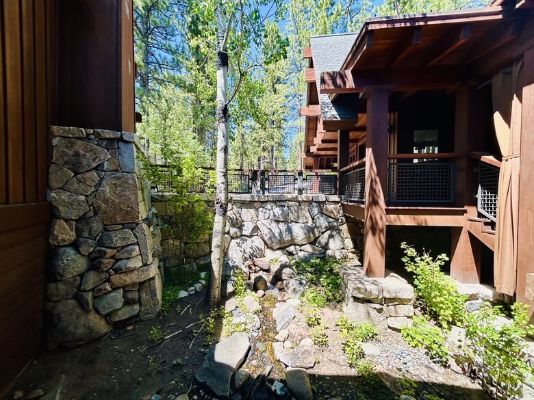 Outdoor water feature & native garden at entrance to house