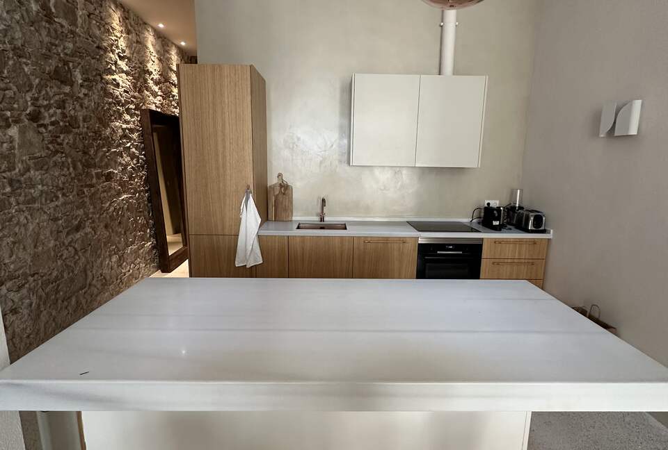 Fully equipped kitchen with marble countertops and island