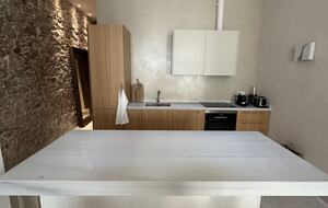 Fully equipped kitchen with marble countertops and island