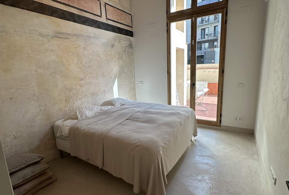 Primary bedroom with en-suite bathroom and access to terrace