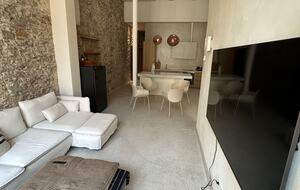 Open living space with 5m ceilings, and original walls