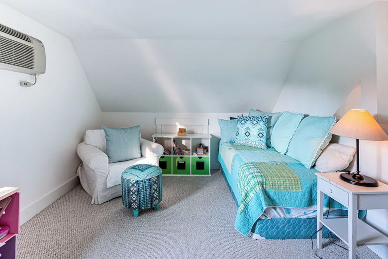 Loft area has two twin beds, a window, and built in A/C unit