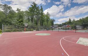 Basketball court next to tennis/pickleball and playground