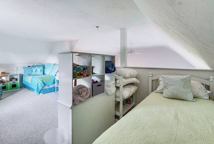 The loft - with 2 beds and play area - overlooks main room