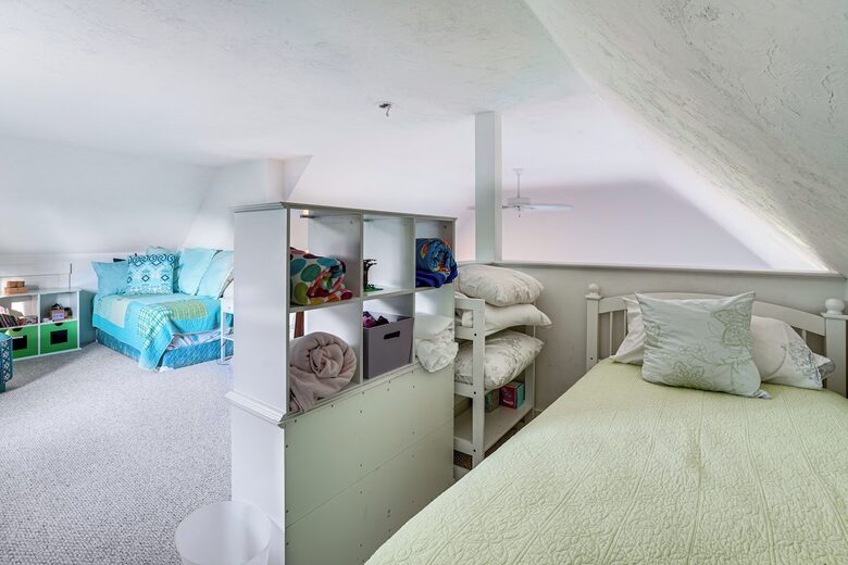 The loft - with 2 beds and play area - overlooks main room