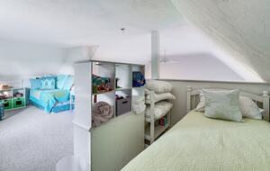 The loft - with 2 beds and play area - overlooks main room