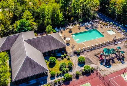 Aerial view of family pool, adjoins w/ bathrooms & pavilion