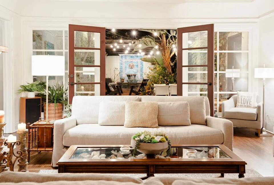 Living room open to both front and back patios