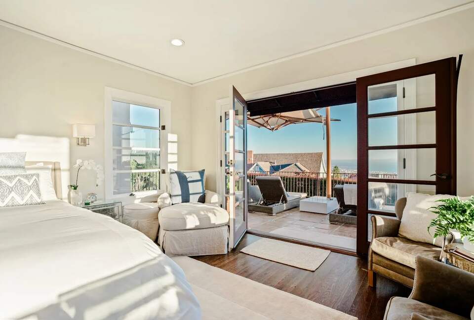 Primary bedroom with ocean views; opens to front patio