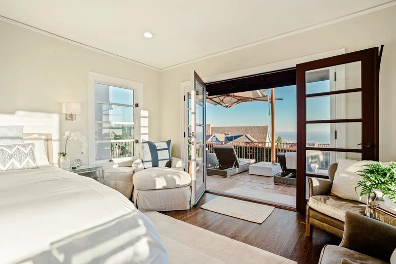 Primary bedroom with ocean views; opens to front patio