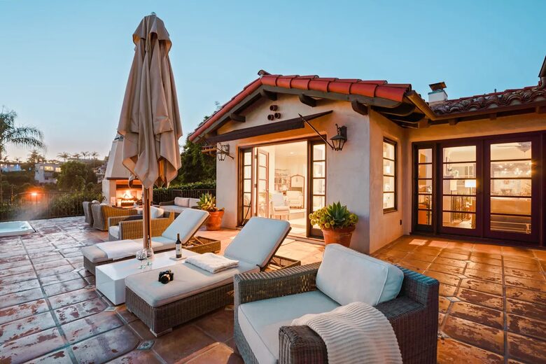 Primary bedroom and living room open to the private front patio