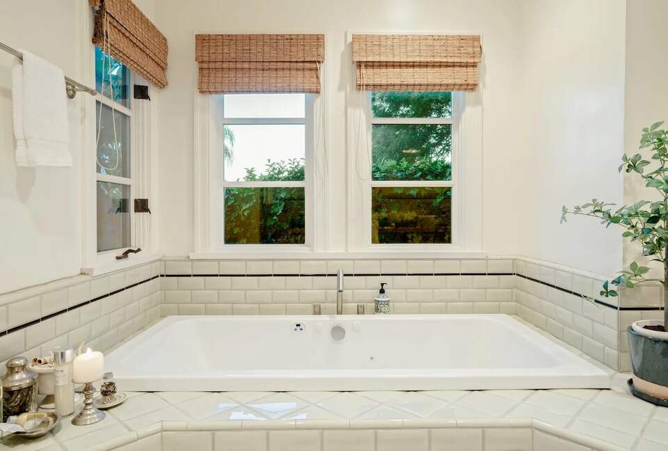 Primary en suite spa tub with ocean views