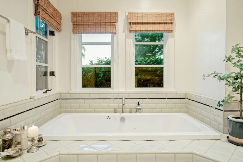 Primary en suite spa tub with ocean views