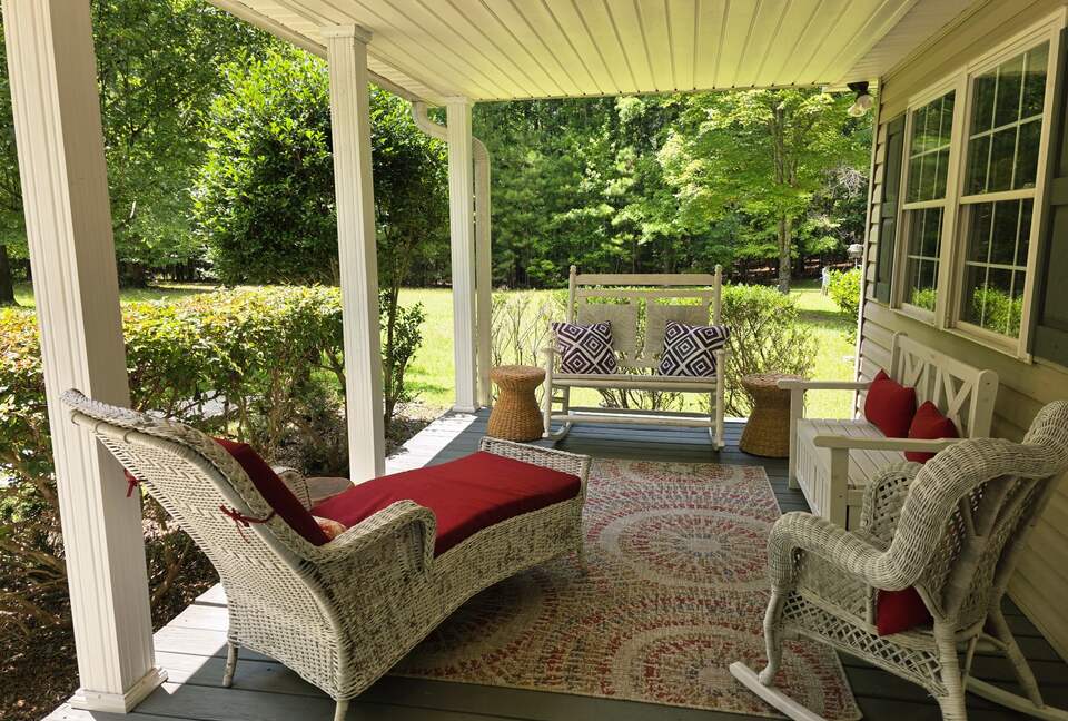 Welcoming front porch w/ ample seating & outdoor grill.