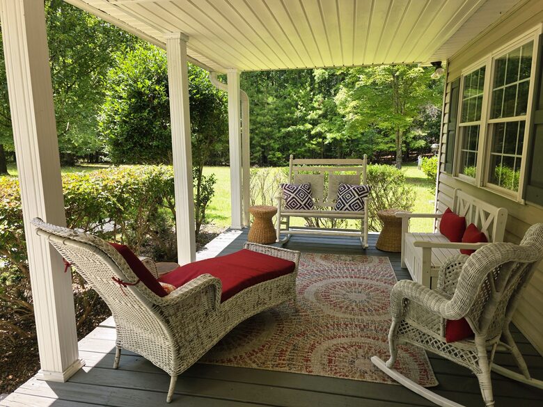 Welcoming front porch w/ ample seating & outdoor grill.