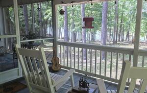 Porch w/adjoining screen porch.