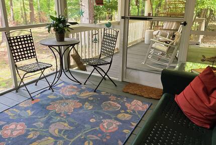 Screened porch looks out to lake.
