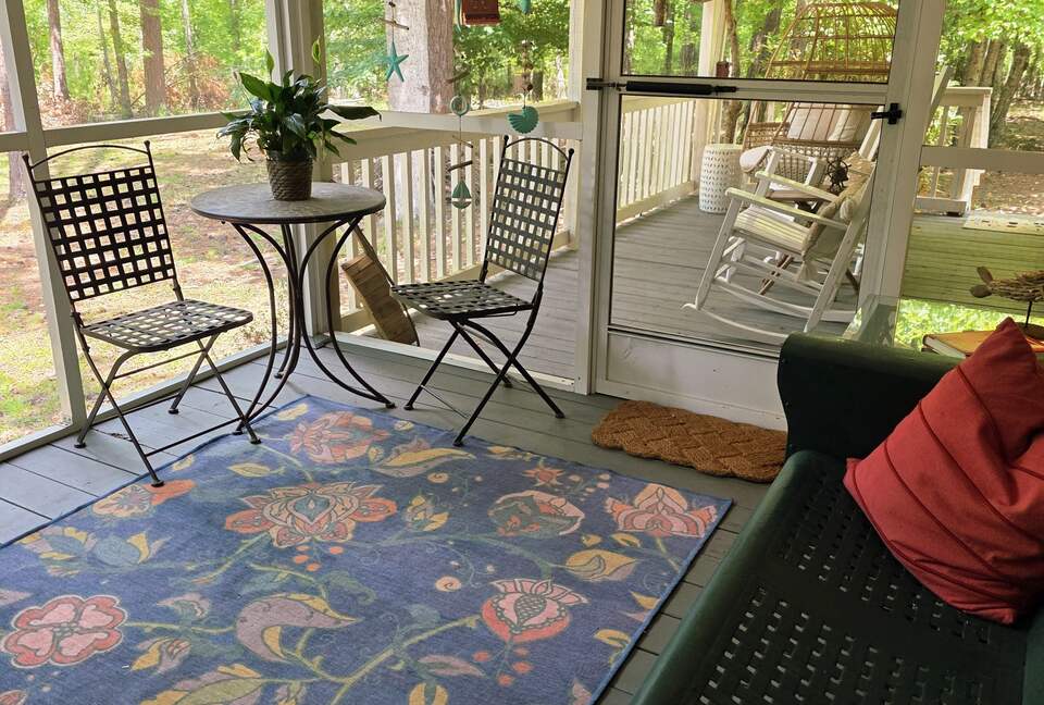 Screened porch looks out to lake.