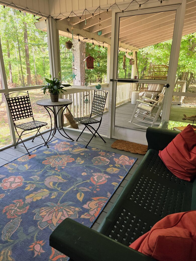 Screened porch looks out to lake.