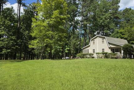 Large & open yard w/ nature path, firepit, seating & EV plug in.