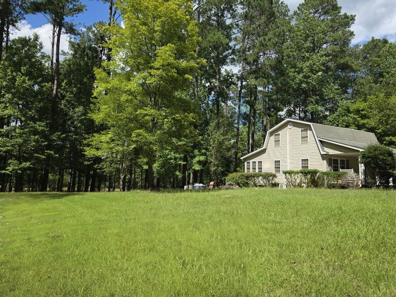 Large & open yard w/ nature path, firepit, seating & EV plug in.
