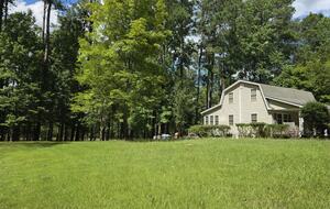 Large & open yard w/ nature path, firepit, seating & EV plug in.