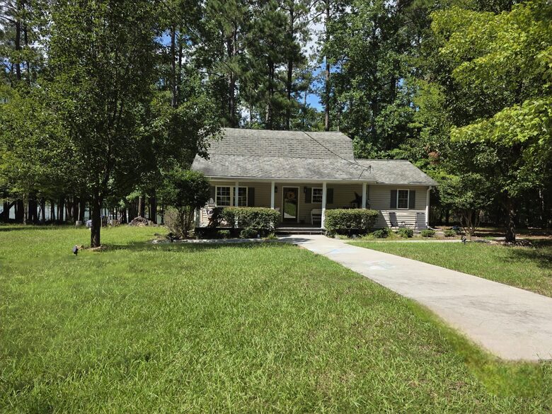 Front of home with lake.