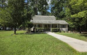 Front of home with lake.