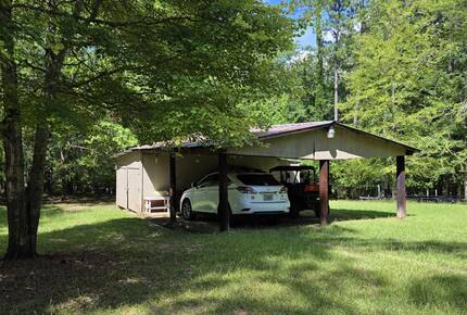 Covered parking for two vehicles.