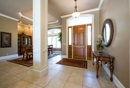 Foyer front entrance with Dining table in background