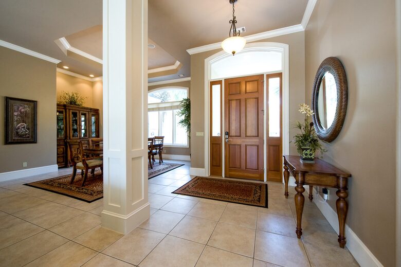 Foyer front entrance with Dining table in background